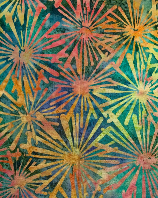 A patterned cotton cover for a 1 gallon jar used to brew kombucha.  This pattern is repeating series of vibrant batik sunburst in yellow, greens, blues and warm reds and oranges.  